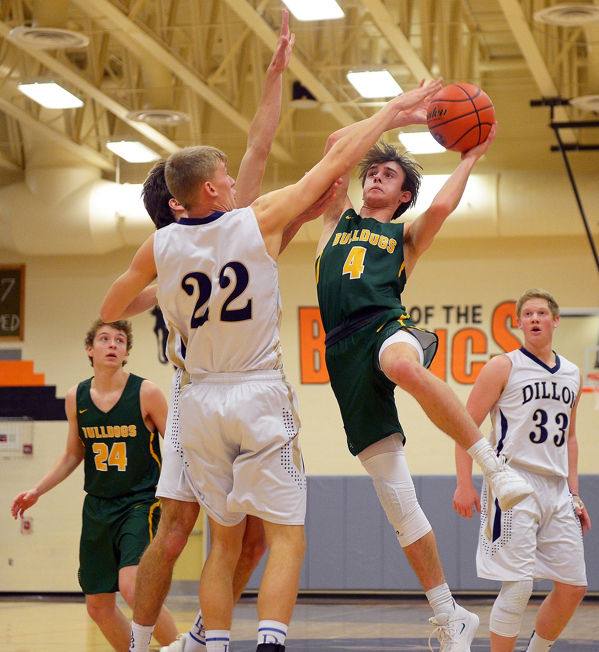 Whitefish's Bodie Smith takes the ball up against Dillon's Braden Anderson Saturday. (Jeremy Weber/Hungry Horse News)