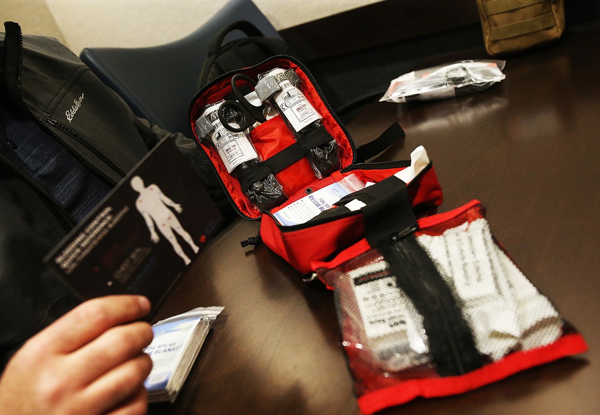 Initial Response kits include QuikClot hemostatic gauze, four yards of regular gauze, compression bandages, a tourniquet, medical scissors, gloves, emergency blankets to prevent shock, chest seals to prevent the chest cavity from filling up with air in the incident of trauma, and an instruction card. (LOREN BENOIT/Press)