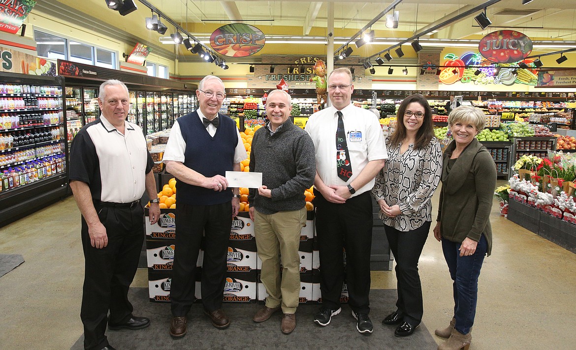 LOREN BENOIT/Press
Super 1 Foods generously donated $7,500 to Press Christmas For All. From left: Eric Haakenson with the Hagadone Corporation, Super 1 Foods President Ron McIntire, Coeur d&#146;Alene Press Publisher Clint Schroeder, Hayden Store Manager Brian Howell, Coeur d&#146;Alene Press Advertising Director Kari Packer, and Charity Reimagined founder Maggie Lyons.