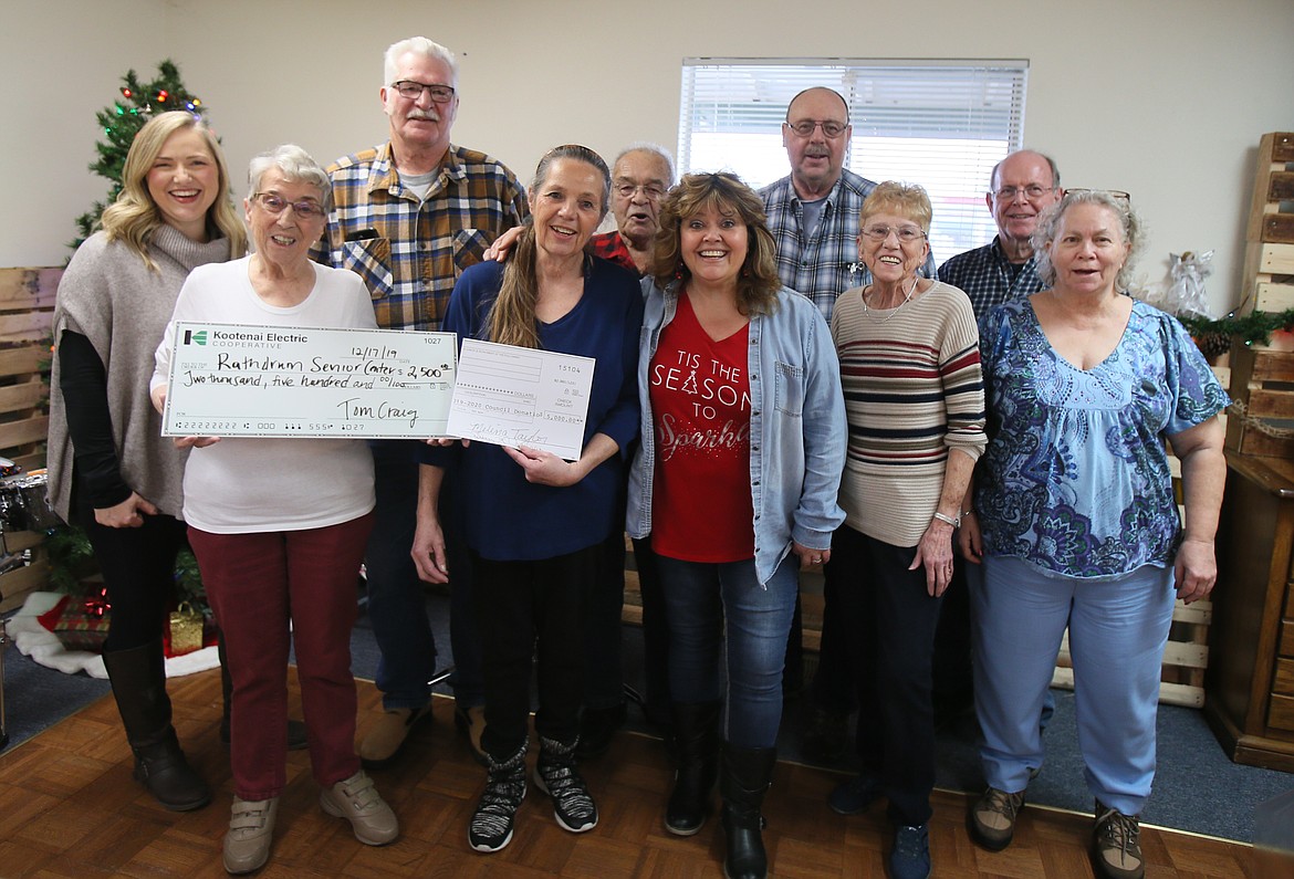 The city of Rathdrum and Kootenai Electric Cooperative contributed a collective $7,500 to the Rathdrum Senior Center to help the center pay for a new oven. Representatives from KEC and the senior center gathered on Tuesday to celebrate the gift. Front row, from left: Carroll Haviland, Wanda Lyon, Rhonda Story, Ruth Waldron and Vicky LaPuzza. Back row, from left: Melissa Newcomer, Wayne Dust, Ken Hill, Dewey Berndt and Duane Brown. (DEVIN WEEKS/Press)