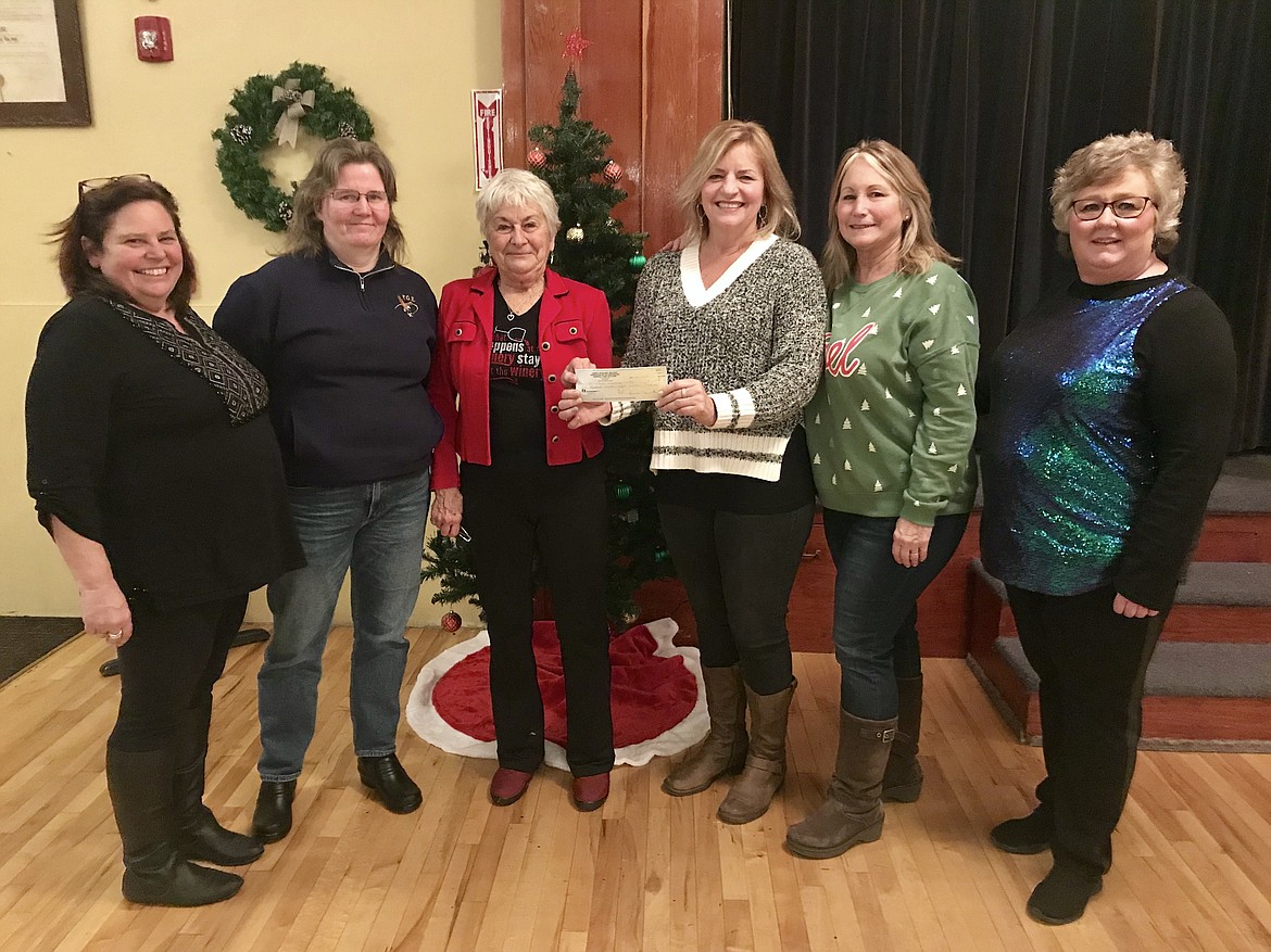 The Coeur d'Alene Eagles Auxiliary donated $500 to St. Vincent de Paul North Idaho for the winter warming cente, which is open when the temperature drops below 28 degrees during the winter months. Pictured from left are Eleanora Capaul, Heather Callahan, Julie Robinson, St. Vincet De Paul Development Director Barb Smalley, Laura Lachapelle and Cathy Hudson. (Courtesy photo)