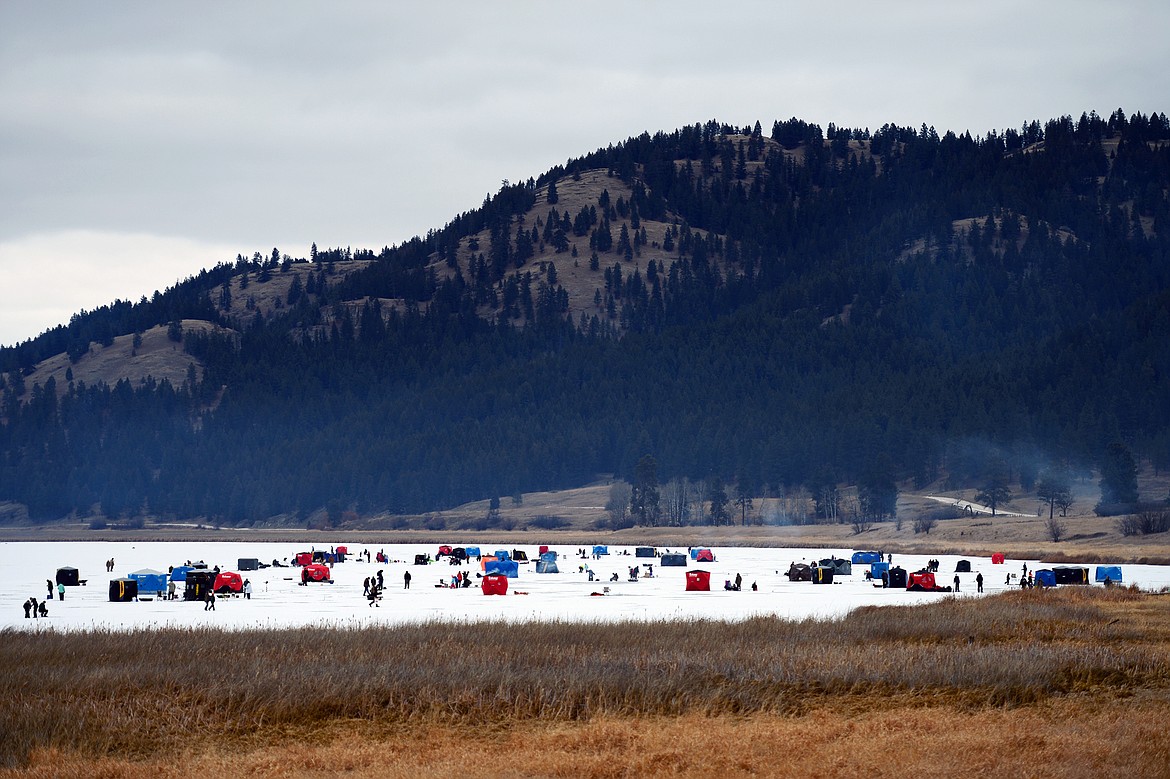 Ice fishing tents dot the frozen surface of Smith Lake at the 49th annual Sunriser Lions ice fishing derby on Saturday. The Flathead Chapter of Walleyes Unlimited donated 100 rod and reel sets to be given away at the derby, which serves as a fundraiser for the Sunriser's family fishing pond programs. The Lions also served up a variety of burgers, hot dogs, chili and hot drinks for attendees. (Casey Kreider/Daily Inter Lake)