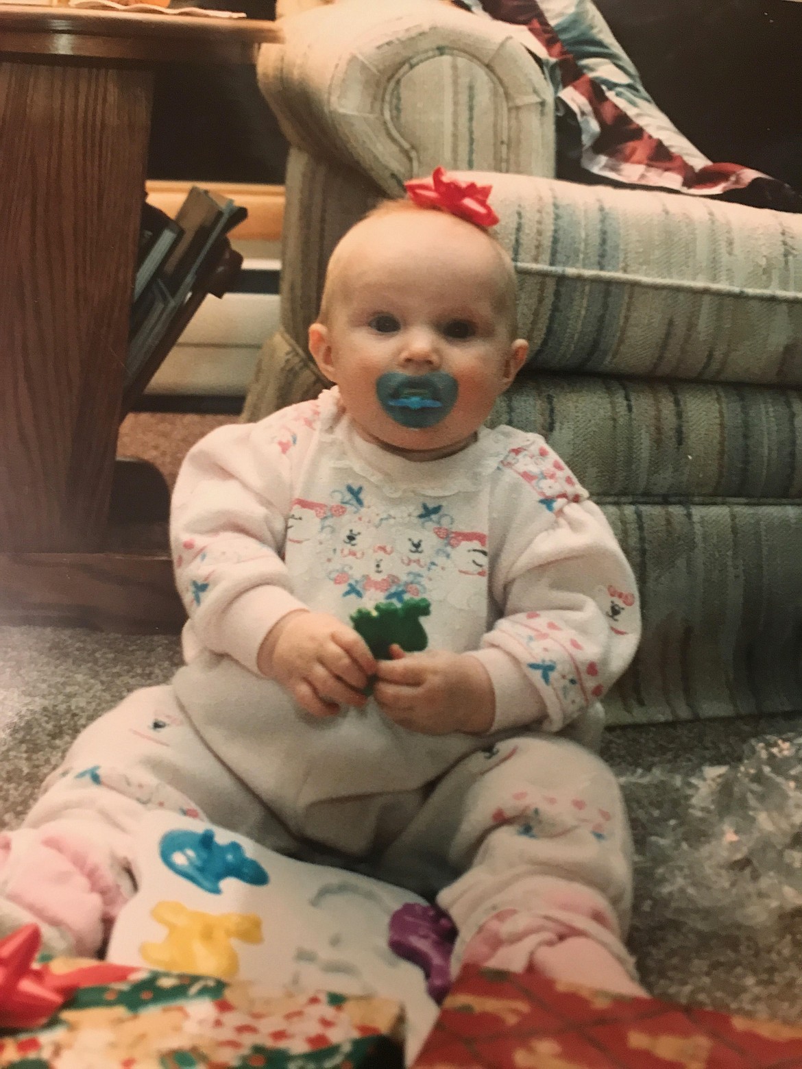 Kianna Gardner sports a Christmas bow as a toddler.