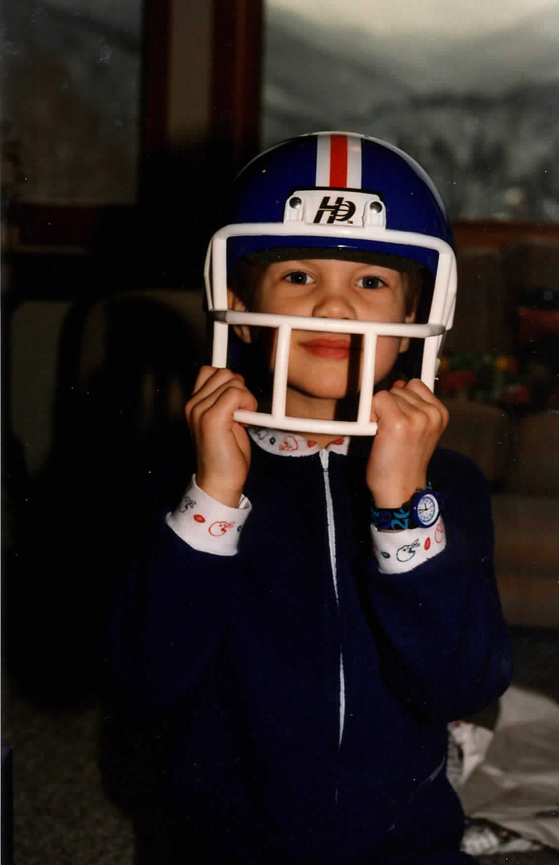 Colin Gaiser shows off a hockey helmet he got for Christmas long ago.