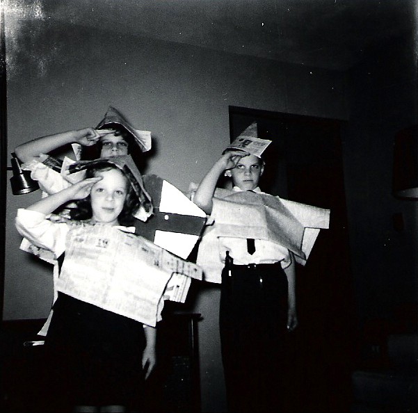 Carol Marino, front left, models her homemade newspaper outfit with her siblings on a snow day in Ohio.