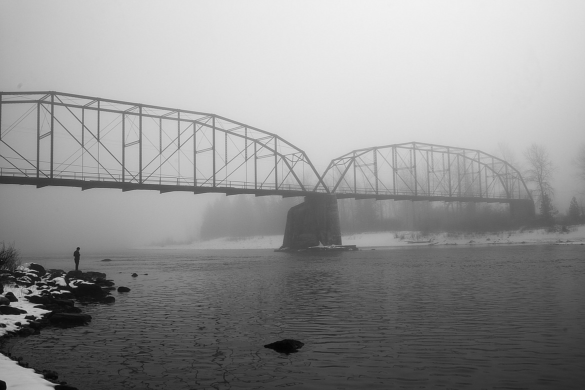 The Red Bridge in Columbia Falls is shrouded by fog.