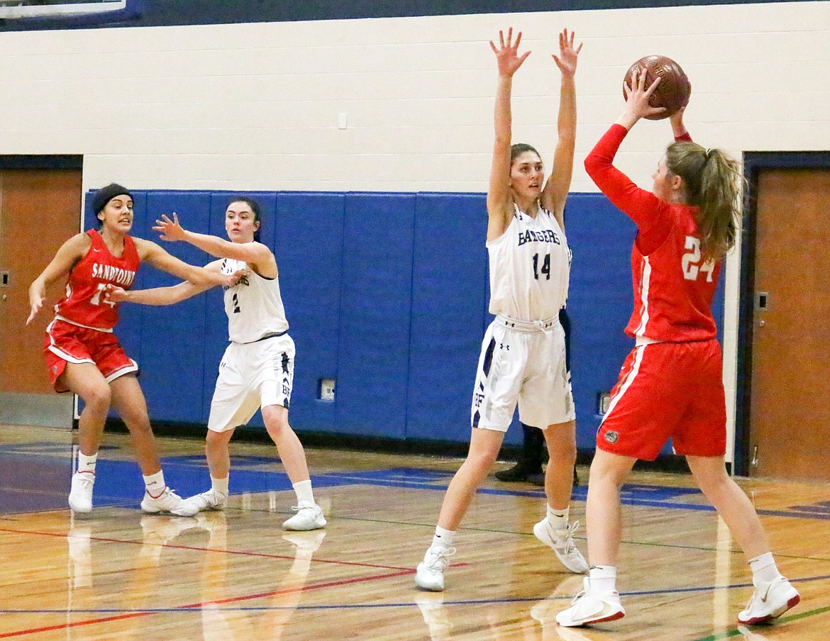 Photo by MANDI BATEMAN
Sierra Petesch (14) defends against Sandpoint during the Badgers&#146; Dec. 19 home game.