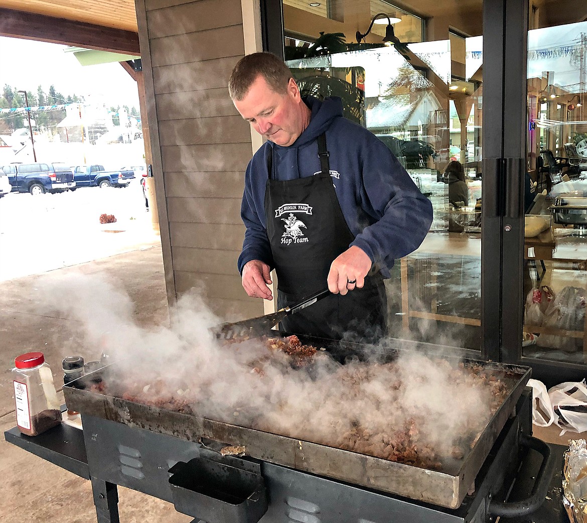 Photo by THAN WIDNER
John Solt, from Elk Mountain Farms, grills up the fresh tacos for the Paisley Fundraising event at Riverside Auto.