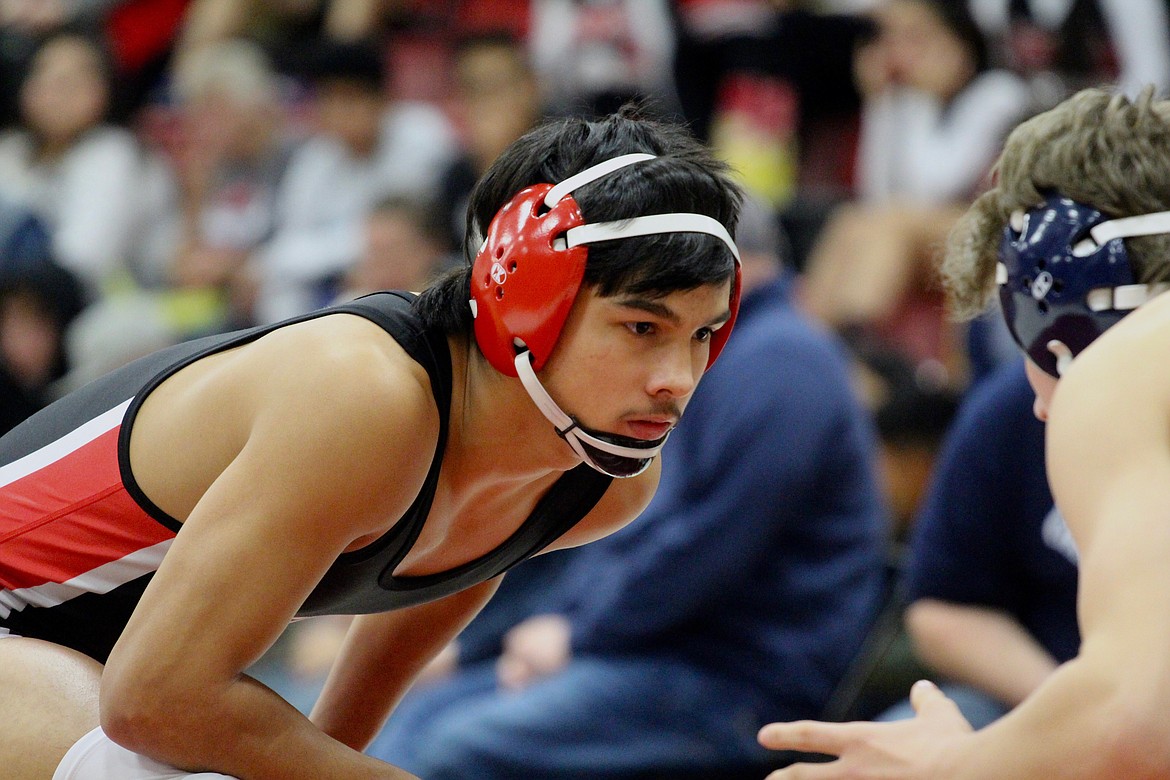 Casey McCarthy/The Sun Tribune 
Jaxon Rocha stairs down his opponent, Zeke Crockett, from Jackson (Chewelah) before their bout. Othello scored 83 points as a team to take 13th at the annual Tri-State Tournament.