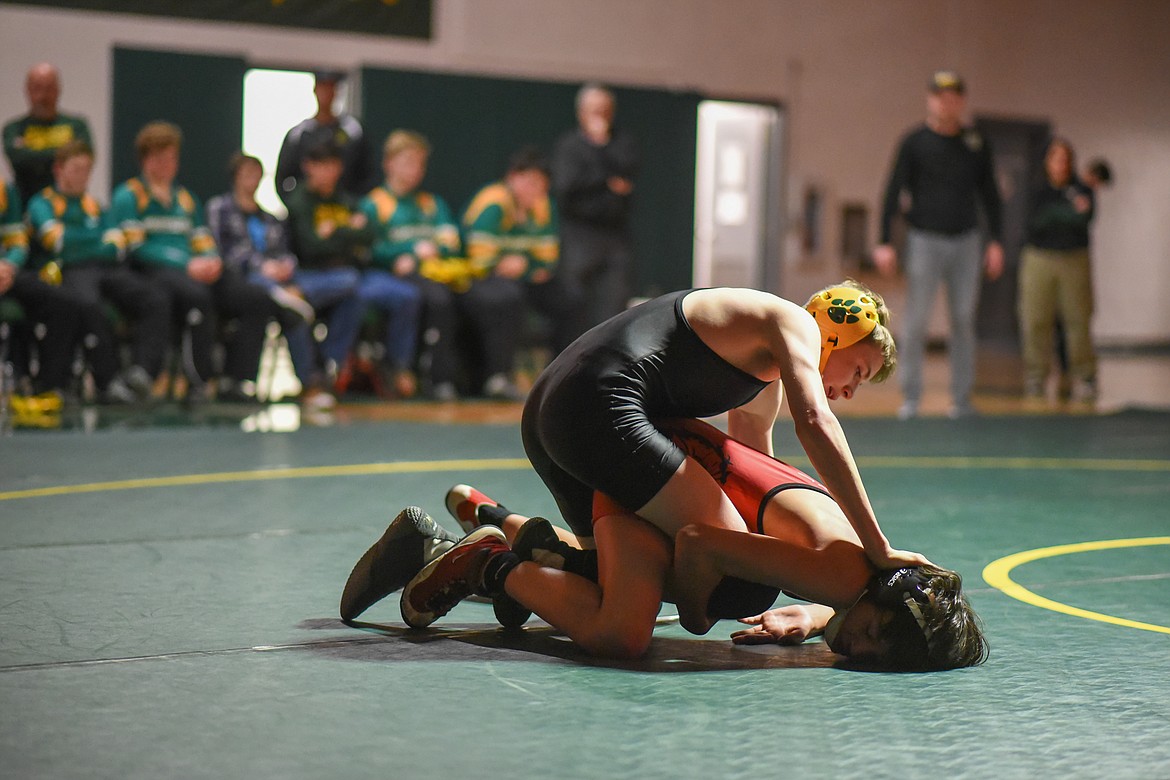 Kadin Brown holds a Browning wrestler down at a home triangular last Tuesday. (Daniel McKay/Whitefish Pilot)