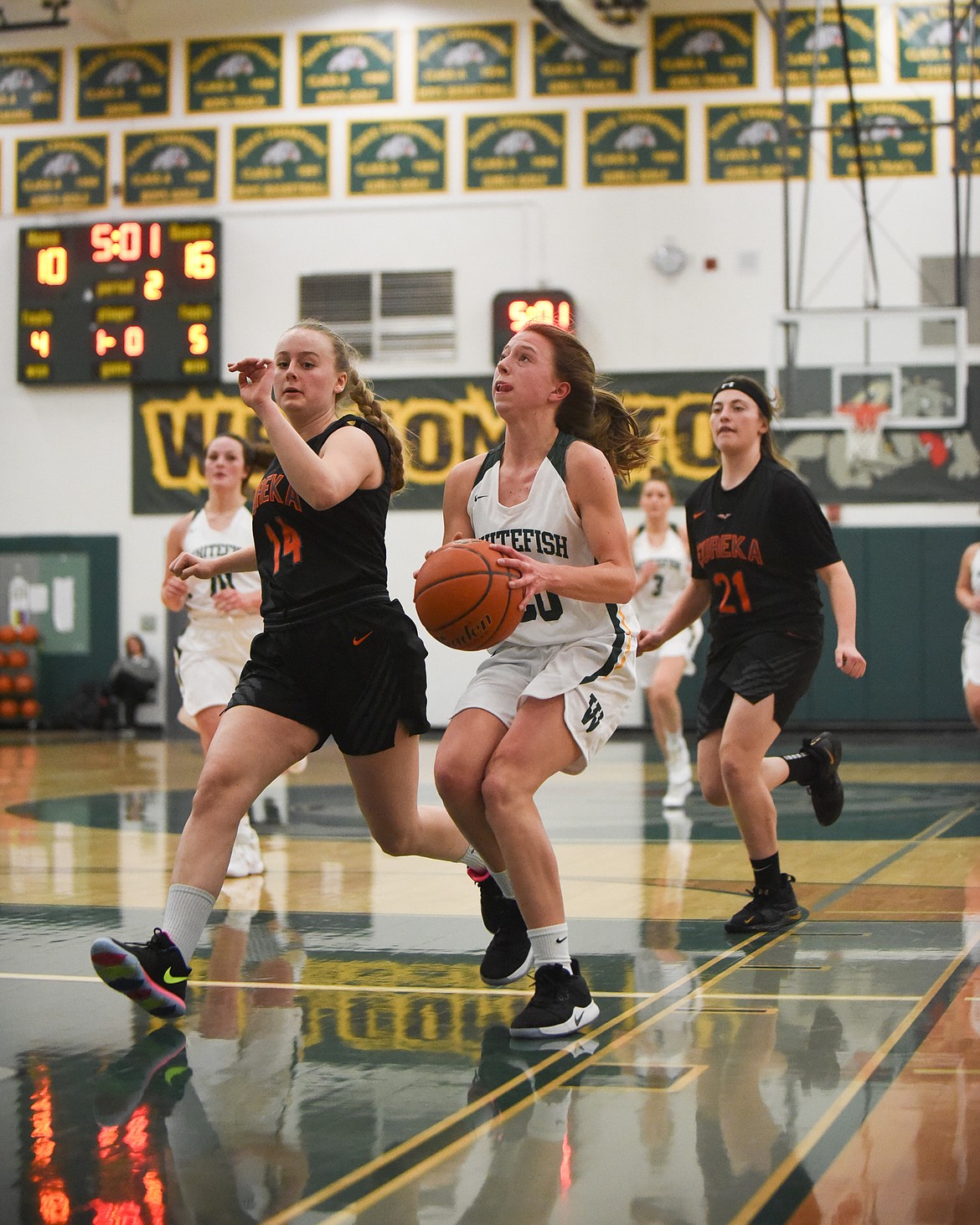 Mikenna Ells looks to finish the transition layup during Thursday's battle against Eureka. (Daniel McKay/Whitefish Pilot)