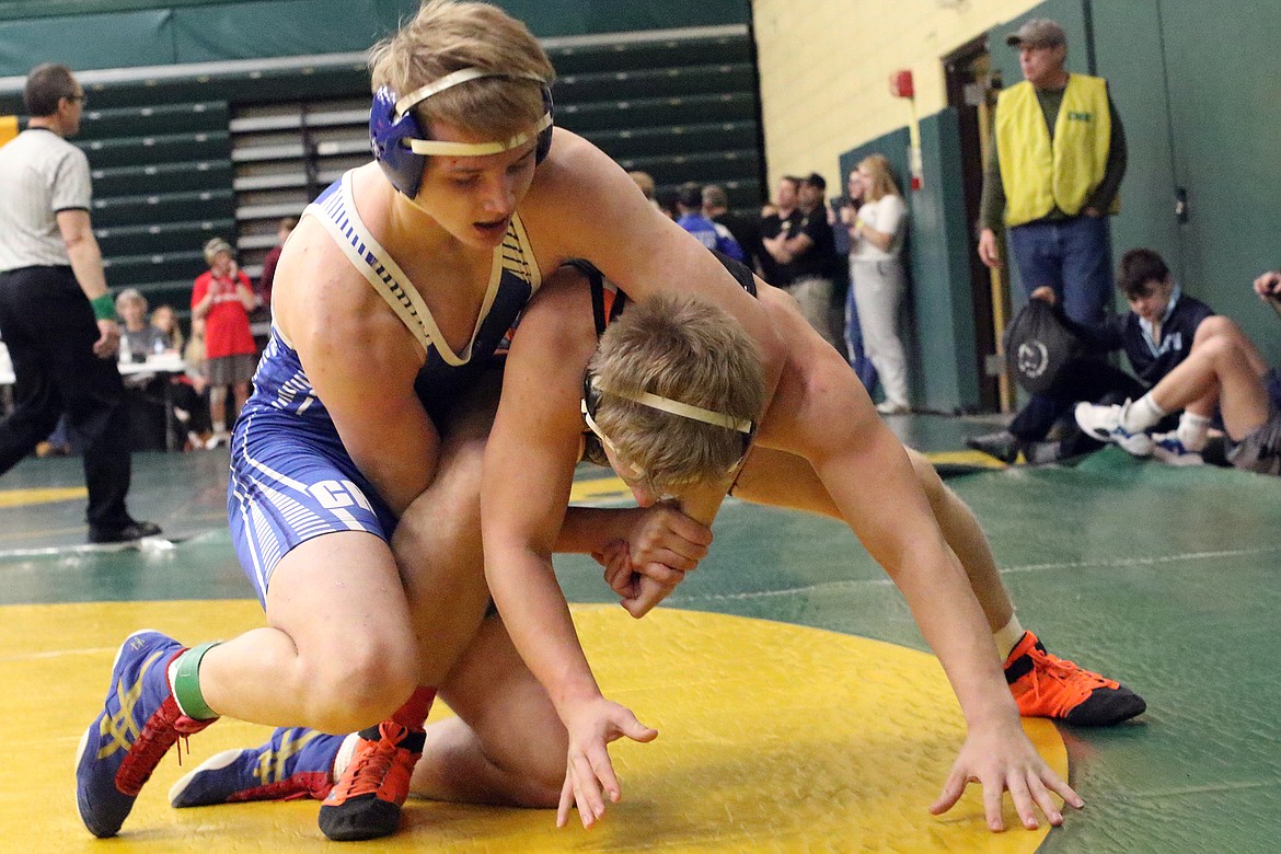 Josh Bertram battles Ronan&#146;s Daniel Collins Bishop at the CM Russell Holiday Classic Saturday. (Bob Windauer photo)