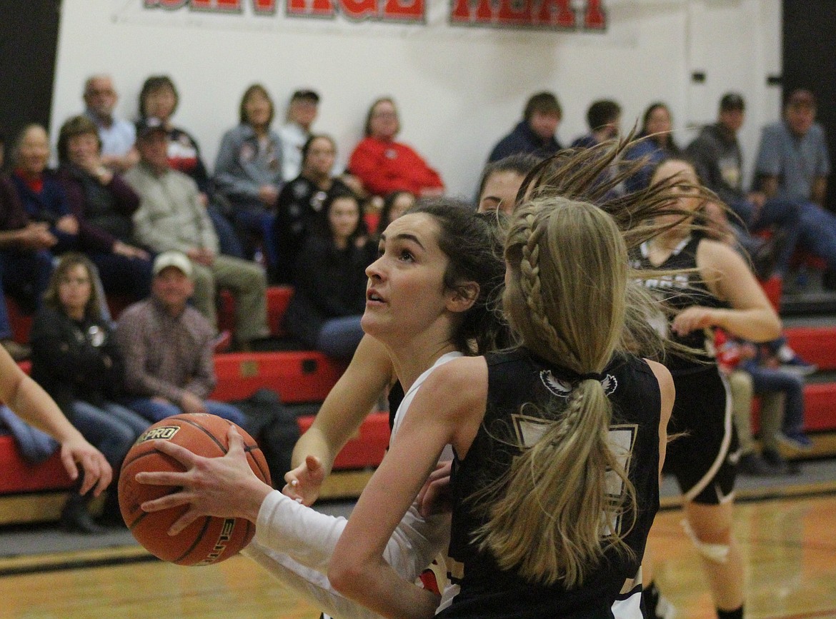 LILY WINN goes up for her game-winning shot for Hot Springs. (John Dowd/Clark Fork Valley Press)