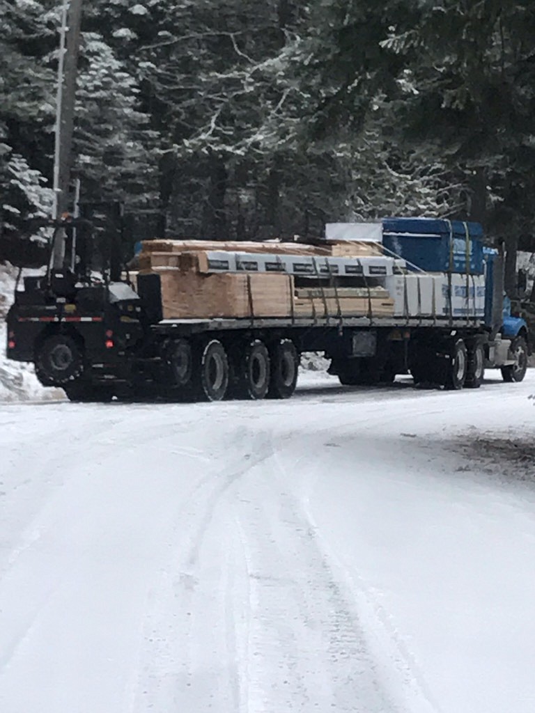 Courtesy of Lory Kay Baehr
A flatbed carrying lumber to a construction site at the intersection of Timothy Lane and fellow dead-end road East Melendreras. Eight lots and 20 plats mean new traffic issues Timothy Lane residents say the road cannot support.