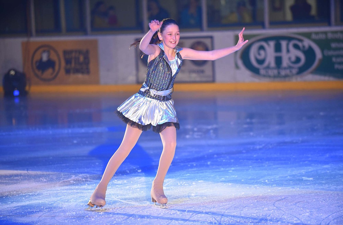 Zoey Marzo&#160;smiles while gliding across the ice during the Glacier Skate Academy&#146;s &#147;Christmas on Ice&#148; show at Stumptown Ice Den. (Heidi Desch/Whitefish Pilot)