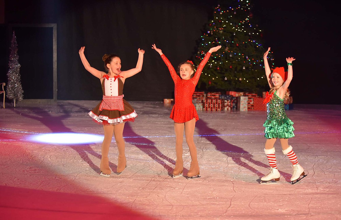 Isley Simpson, Harper McIntyre &#160;and Gianna Mitchell&#160;show their festive spirit during the Glacier Skate Academy&#146;s Christmas on Ice show at Stumptown Ice Den. (Heidi Desch/Whitefish Pilot)