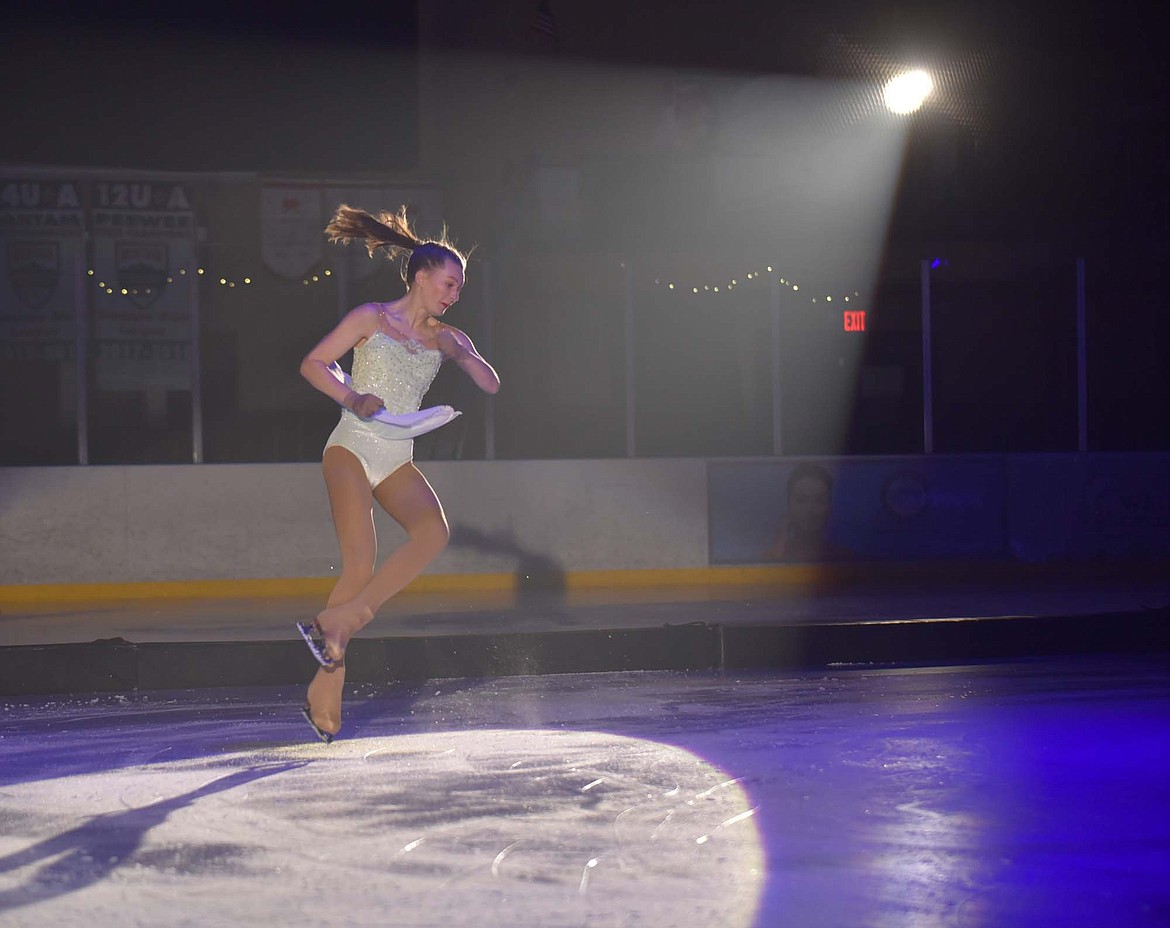 Sophia Burrough&#160;does a move in the air during a performance at the Glacier Skate Academy&#146;s Christmas on Ice show at Stumptown Ice Den. For more photos, visit online at www.whitefishpilot.com. (Heidi Desch/Whitefish Pilot)