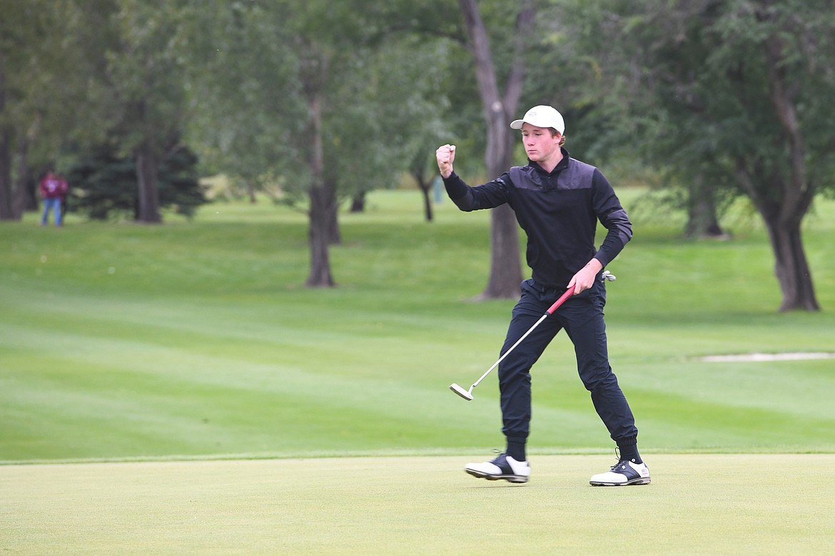 Cameron Kahle reacts after sinking an eagle putt to force a sudden-death playoff at the Class A State Golf Tournament on Friday in Laurel. (Jeff Doorn photo)