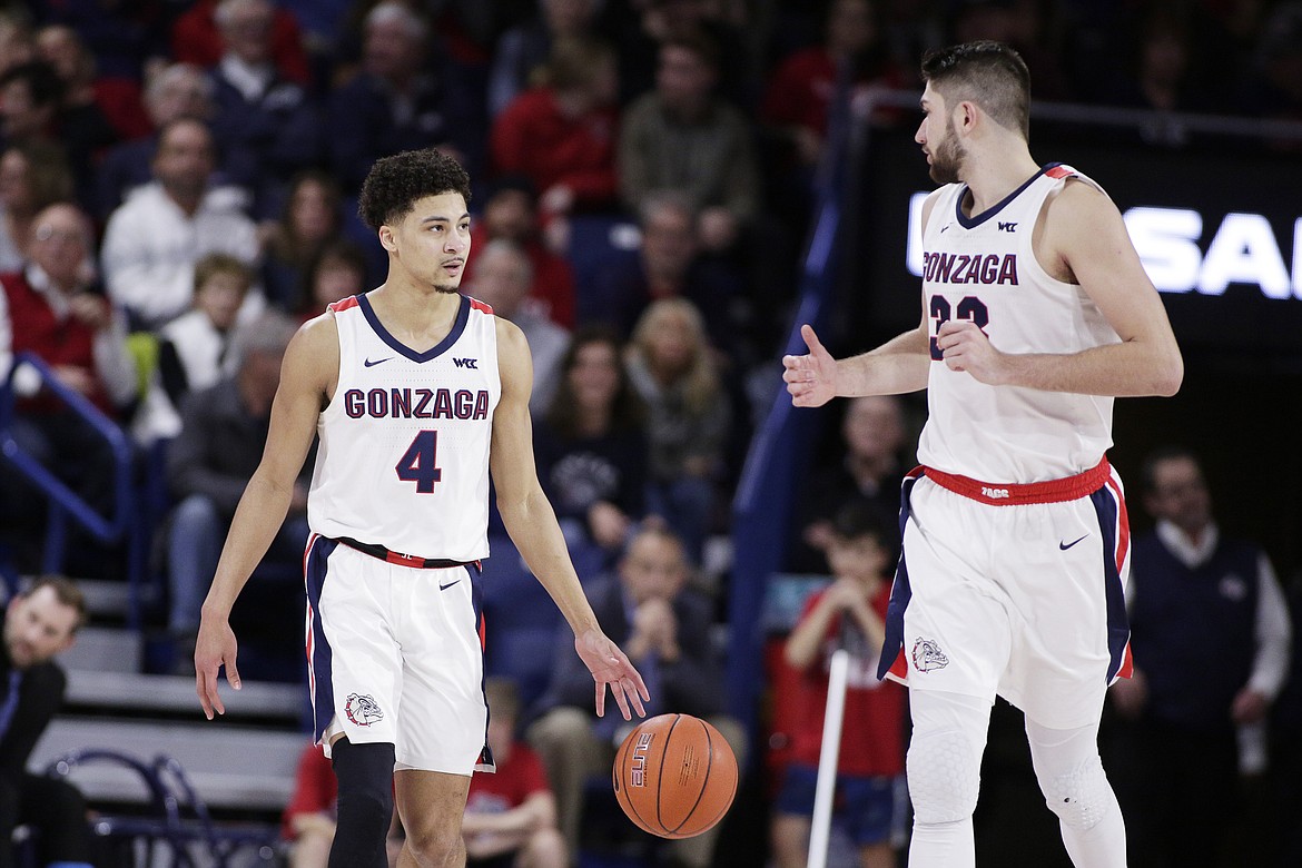 YOUNG KWAK/Associated Press
Gonzaga guard Ryan Woolridge, left, brings the ball up the court while speaking with forward Killian Tillie during the second half against Pepperdine on Saturday in Spokane.