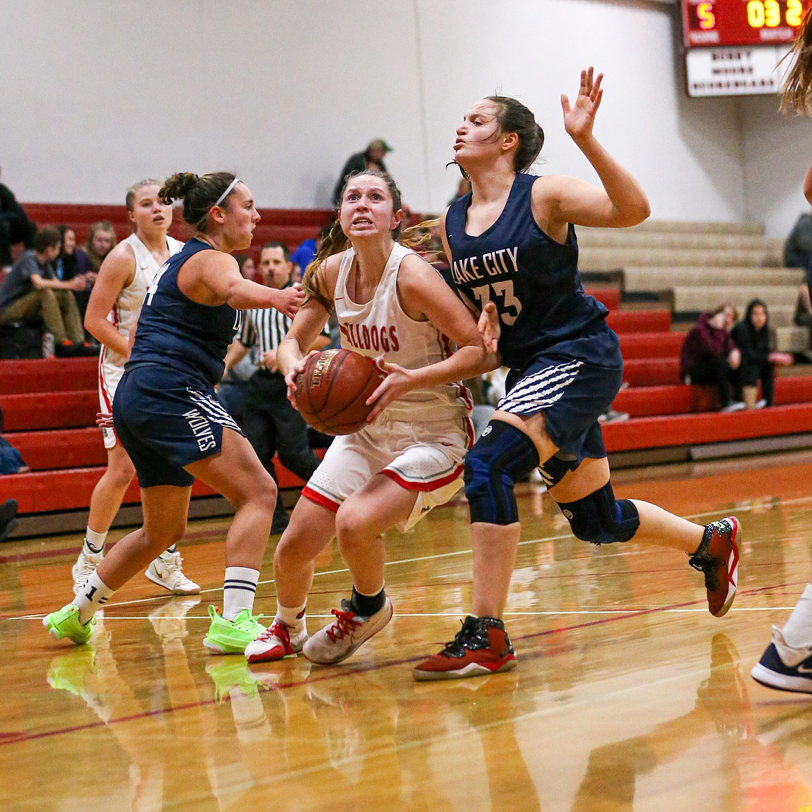 (Photo courtesy of JASON DUCHOW PHOTOGRAPHY)
Senior Dawson Driggs tries to weave through the Lake City defense Wednesday at Les Rogers Court. Driggs finished with 9 points and five rebounds in the game.