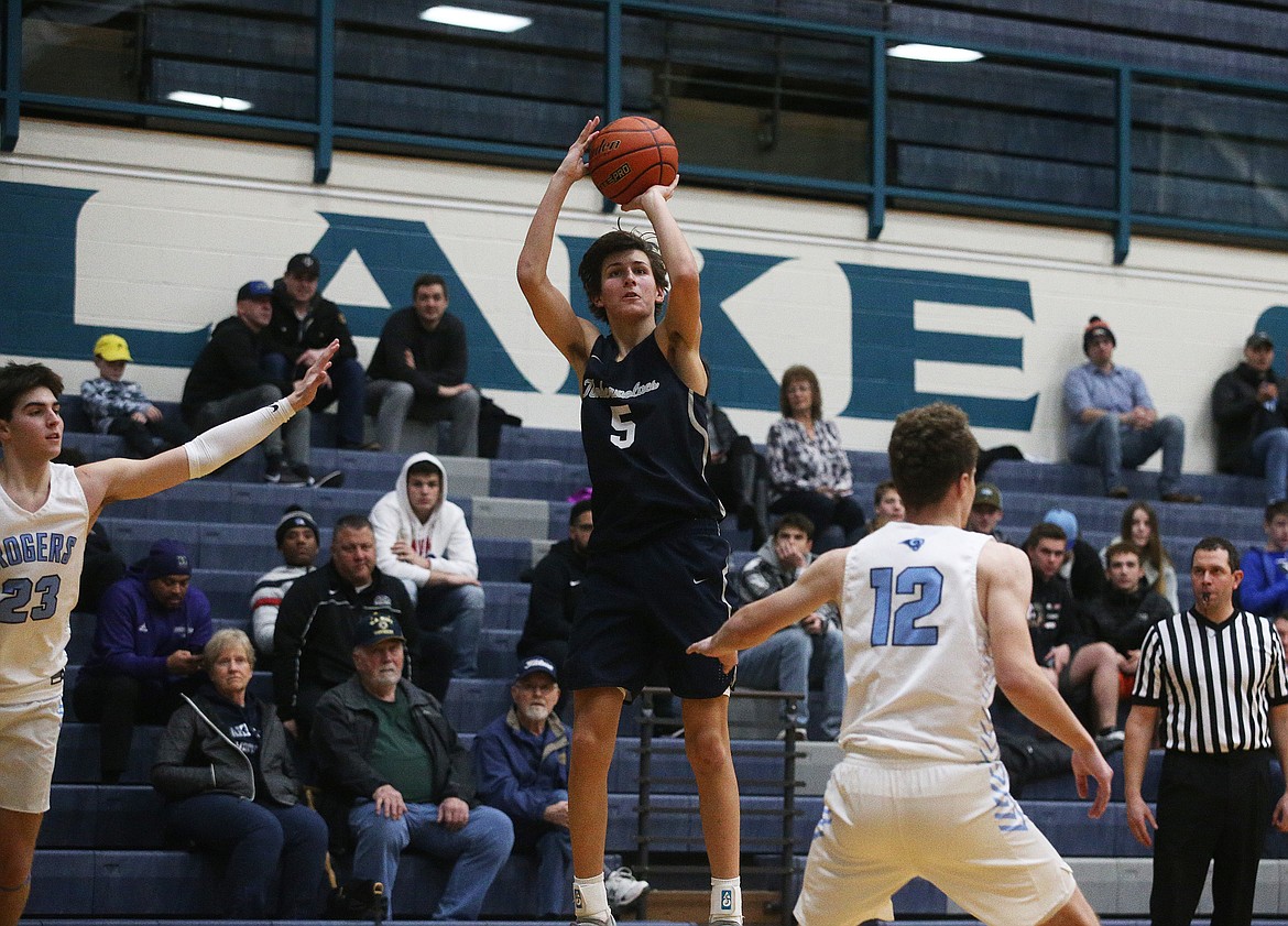 Lake City High&#146;s Jack Kiesbuy shoots a 3-pointer during Friday&#146;s game against Rogers of Puyallup, Wash.