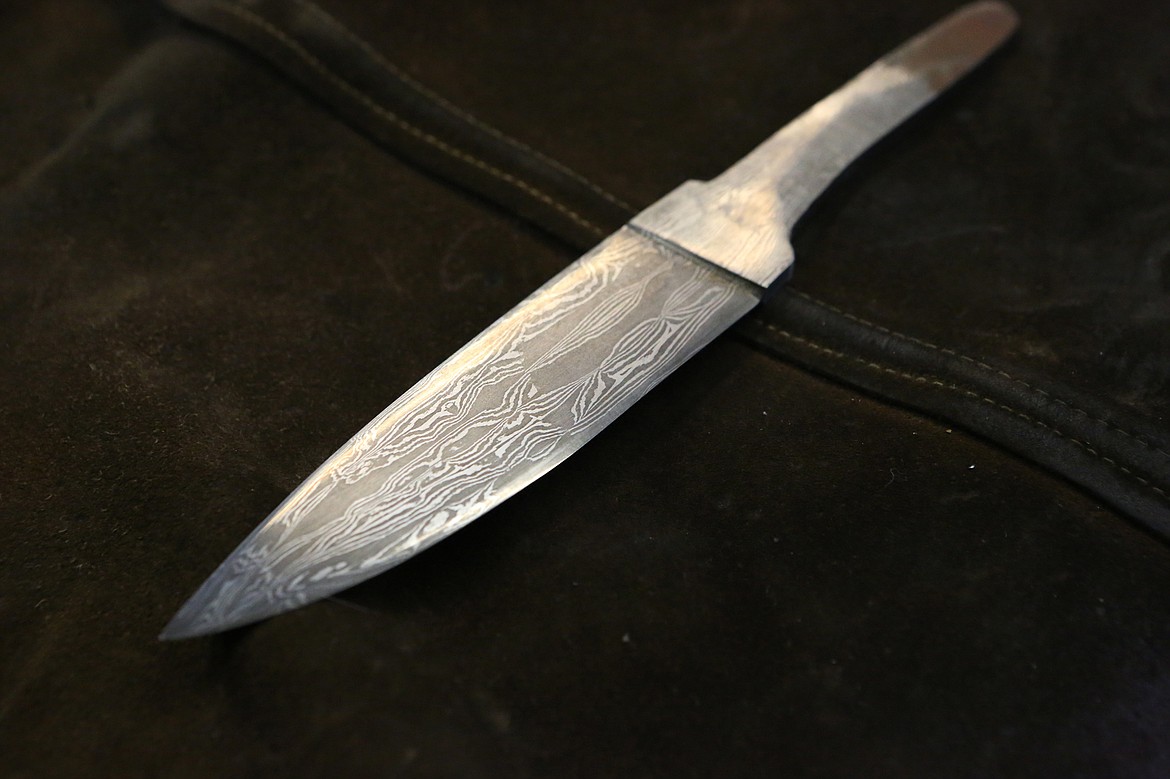 A Damascus steel blade made by Scott Sweder is displayed in his Columbia Falls shop, Iron Bear Knife and Forge.  (Mackenzie Reiss/Daily Inter Lake)