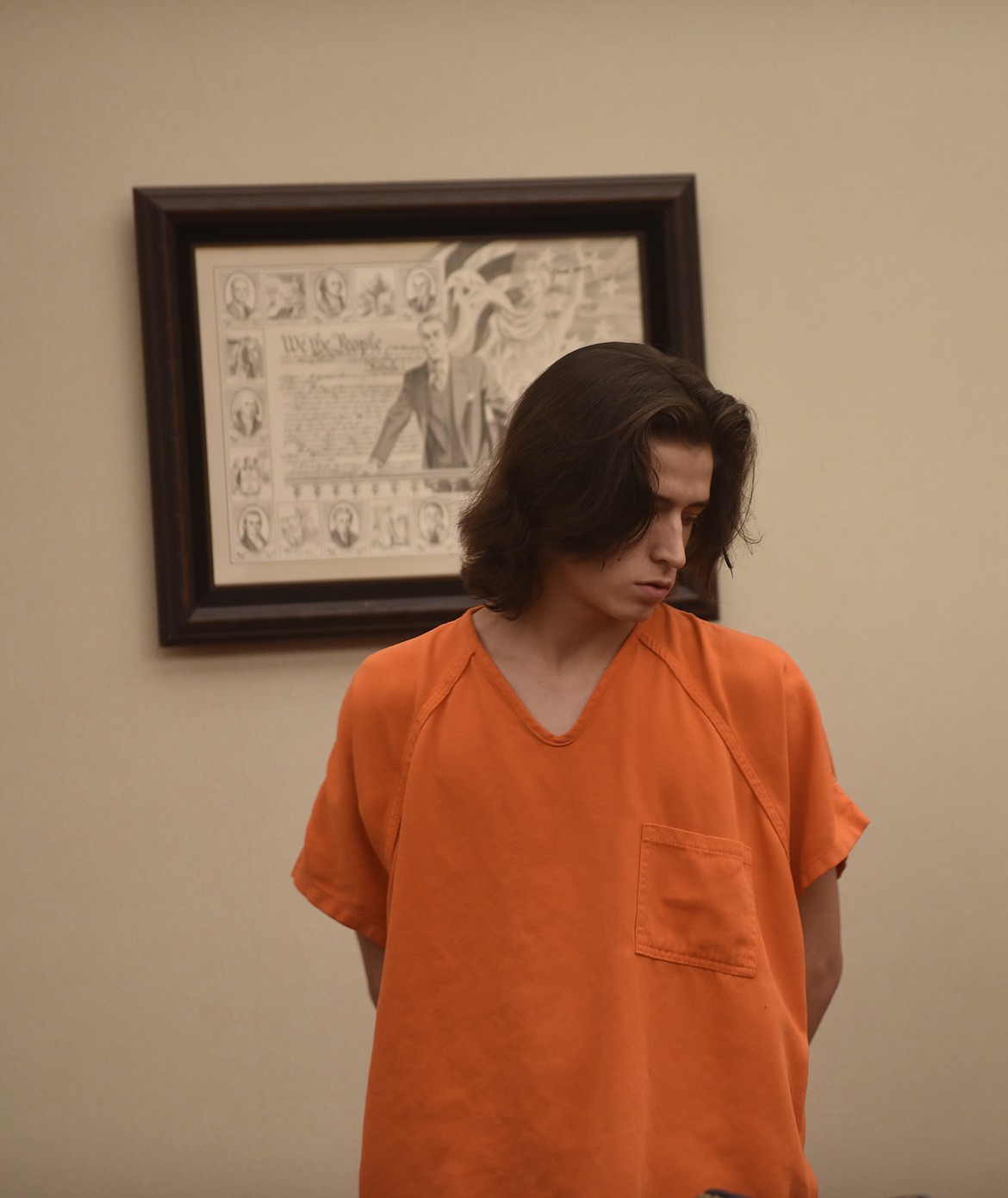 Joseph Trapper Bukowski appears in Flathead County District Court Thursday morning on several felony charges related to an alleged drive-by shooting in Kalispell Dec. 21. Bukowski, through his attorney, Timothy Wenz, pleaded not guilty to five felony charges. (Scott Shindledecker/Daily Inter Lake)