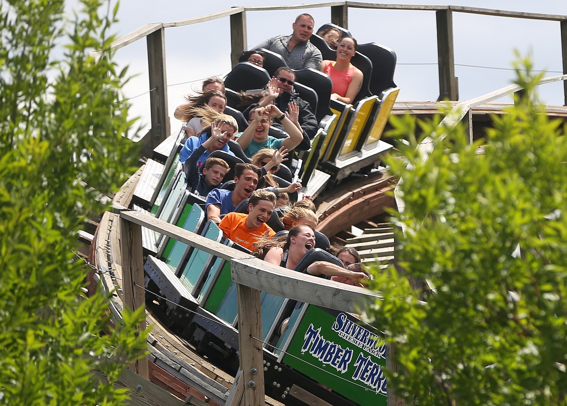 Park guests rip around a turn on Timber Terror at Silverwood Theme Park in Athol.