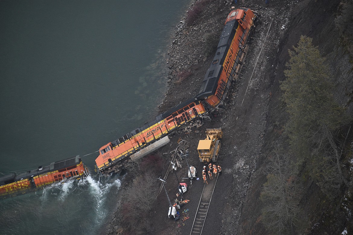 Photo by DYLAN GREENE / Hagadone News Network
Crews work at the site of a Jan. 1 train derailment in which a rockslide knocked three BNSF locomotives and six train cars off the track along the Kootenai River.