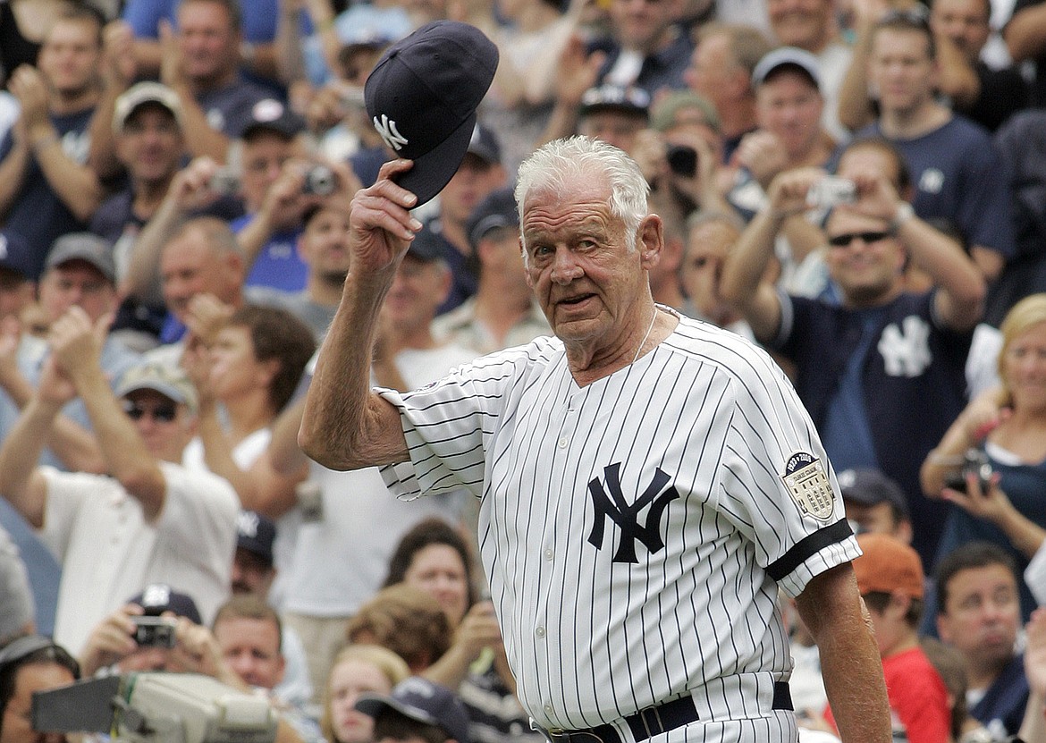 ED BETZ/Associated Press
Don Larsen tips his hat to fans during introduction ceremonies before an old-timers game on Aug. 2, 2008, at Yankee Stadium in New York.