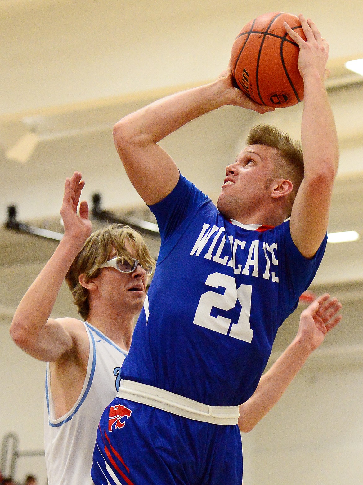 Columbia Falls' Danny Henjum (21) looks to shoot against Bigfork's Asher VanCampen (0) in the first half at Bigfork High School on Friday. (Casey Kreider/Daily Inter Lake)