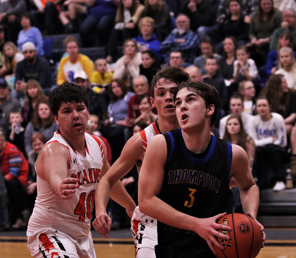 NATHAN SCHRAEDER (3) scores a layup last Friday night against Plains. (John Dowd/Clark Fork Valley Press)