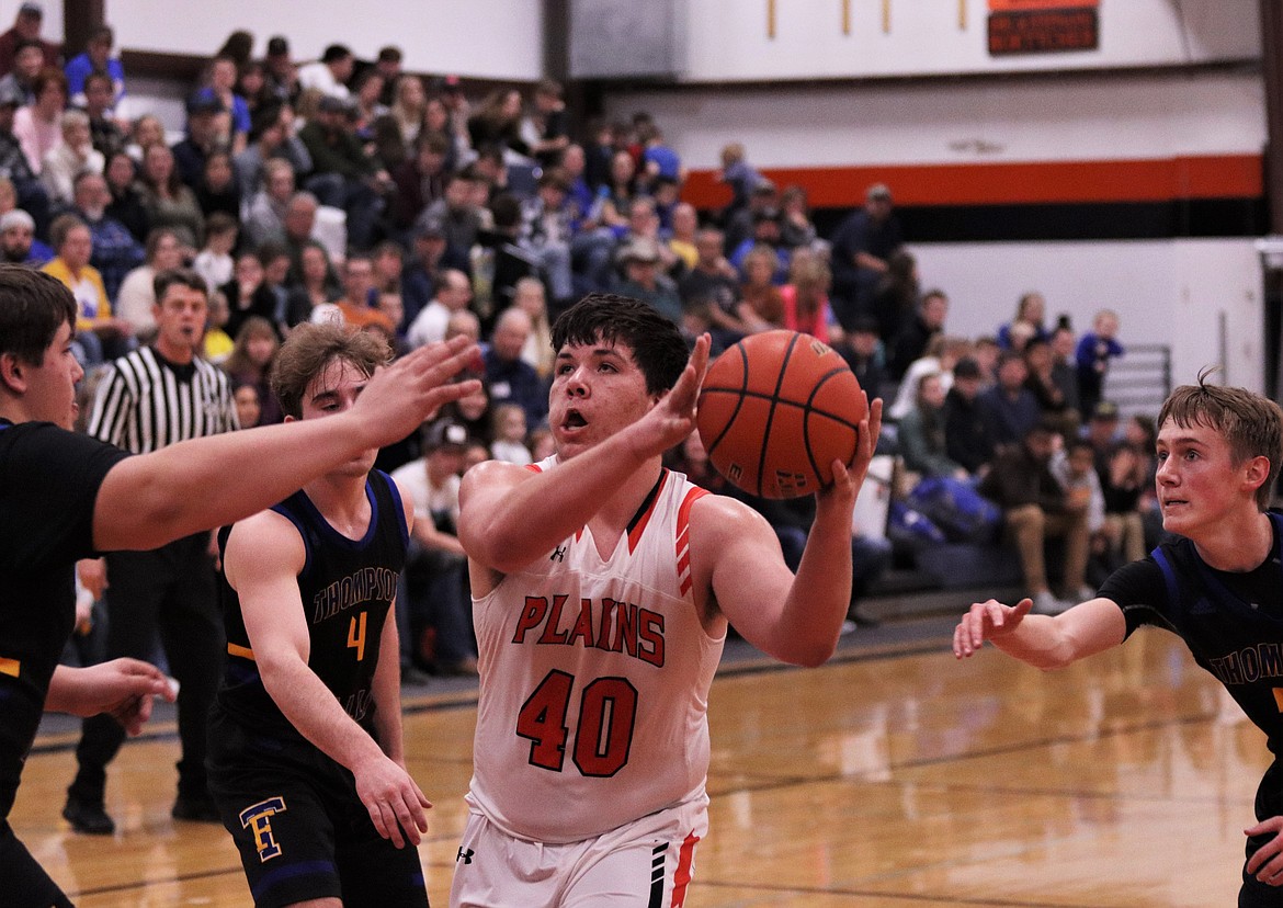 TUCKER FOSTER (40) prepares to pass the ball last Friday night during the Thompson Falls-Plains game. (John Dowd/Clark Fork Valley Press)