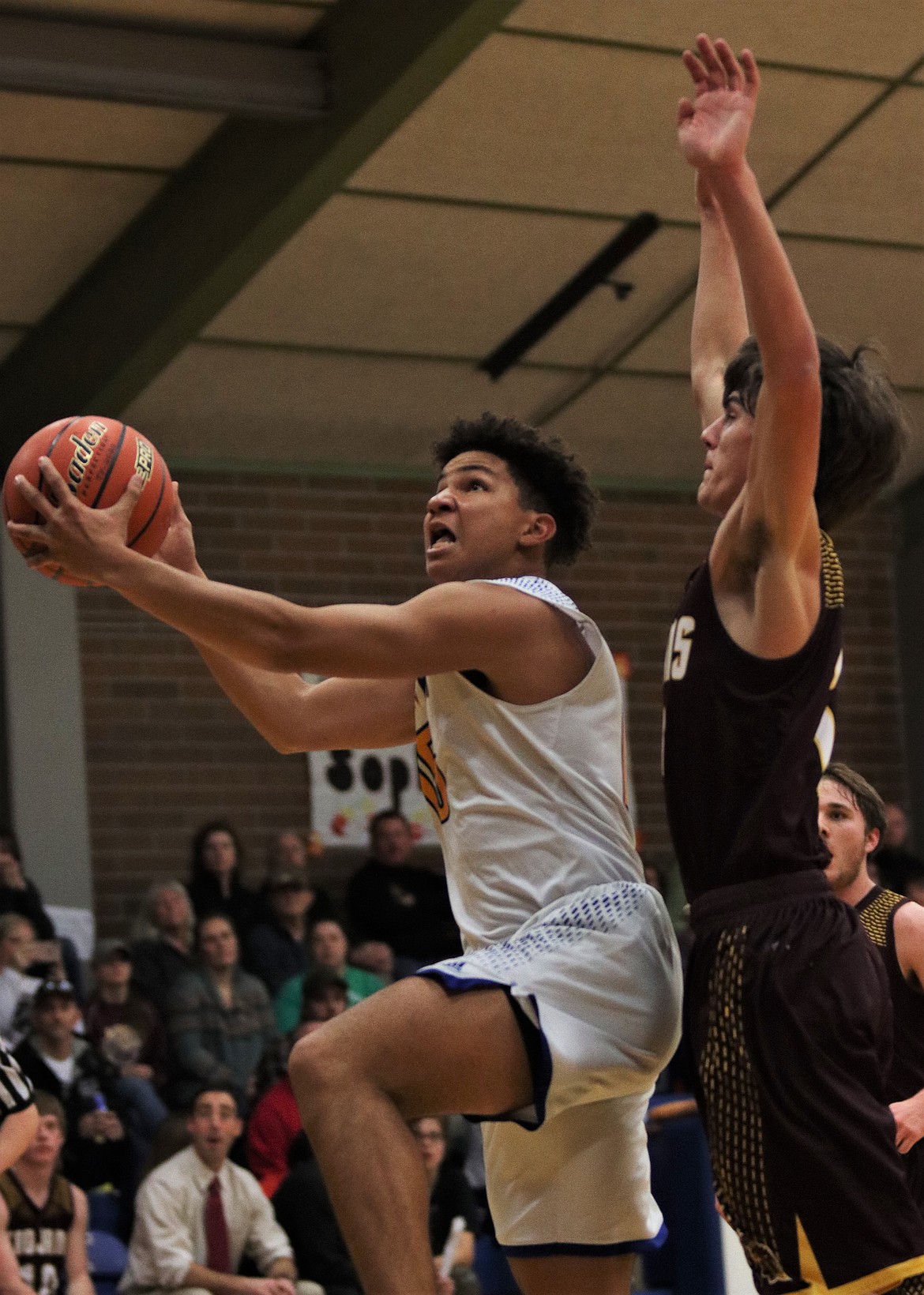 JACK GREENE get past a Troy defender for a layup. (John Dowd/Clark Fork Valley Press)