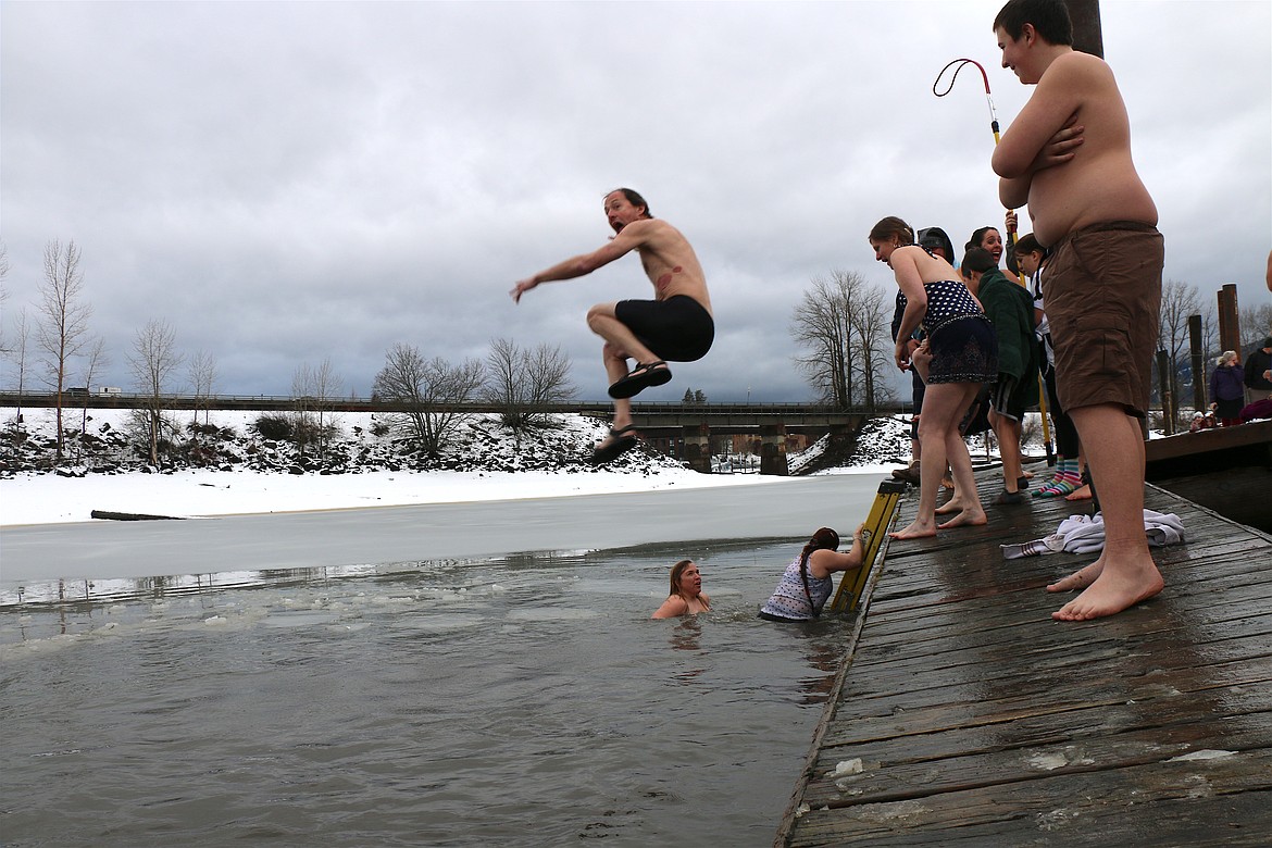 (Photo by CAROLINE LOBSINGER)
A participant grimaces in preparation as he jumps off the dock into a freezing Lake Pend Oreille during the 2020 Polar Bear Plunge on Wednesday.