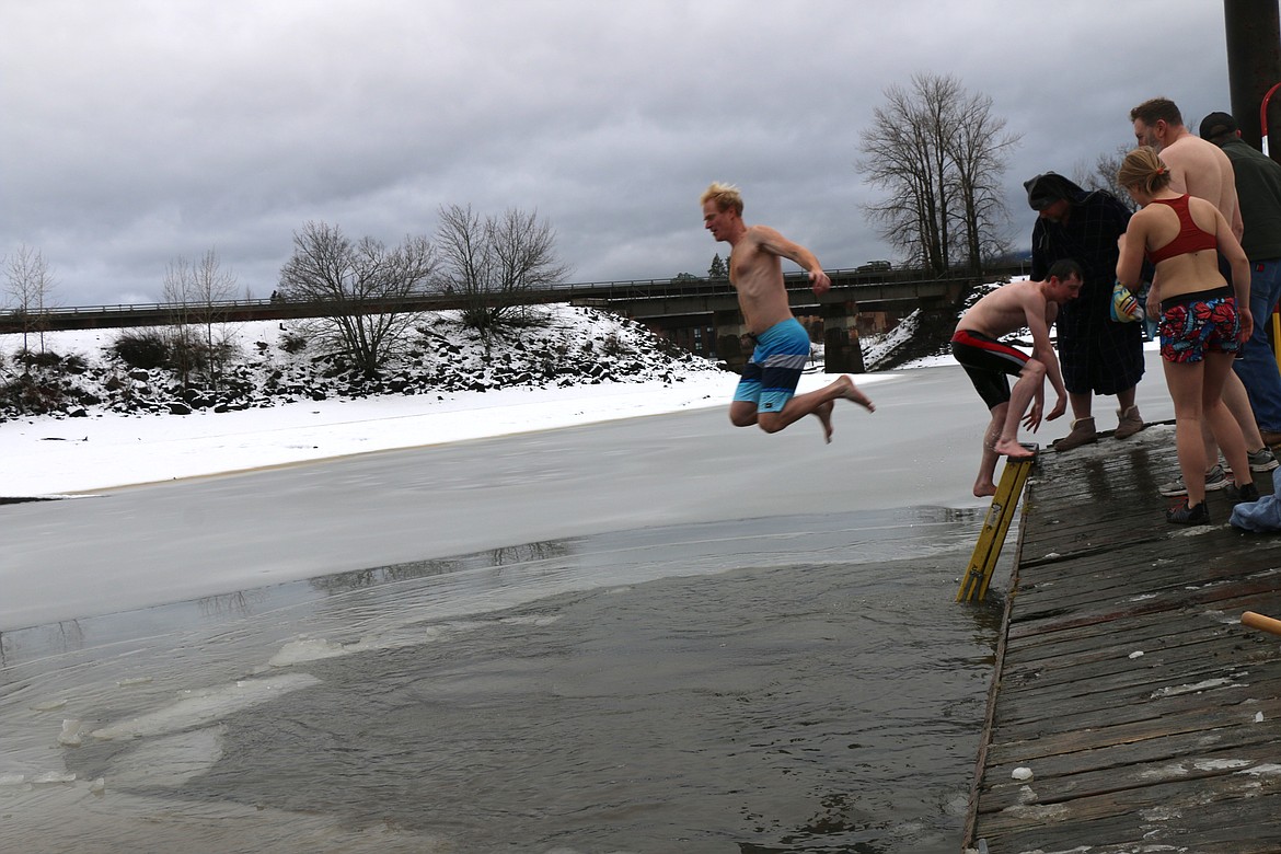 (Photo by CAROLINE LOBSINGER)
A participant leaps from the dock during the 2020 Polar Bear Plunge on Wednesday.