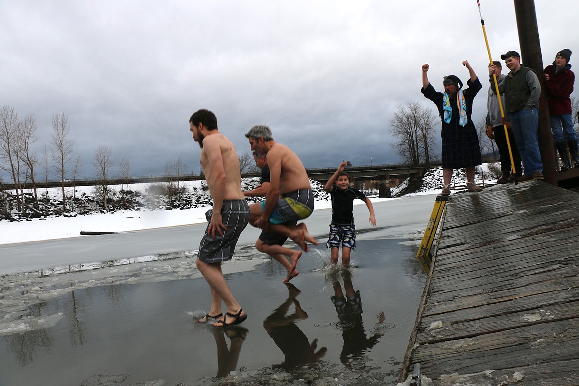 (Photo by CAROLINE LOBSINGER)
Participants jump off the dock into a freezing Lake Pend Oreille during the 2020 Polar Bear Plunge on Wednesday.