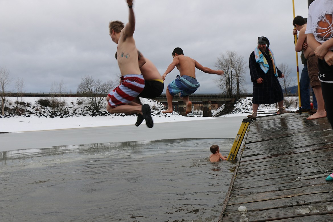 (Photo by CAROLINE LOBSINGER)
Participants jump off the dock into a freezing Lake Pend Oreille during the 2020 Polar Bear Plunge on Wednesday.