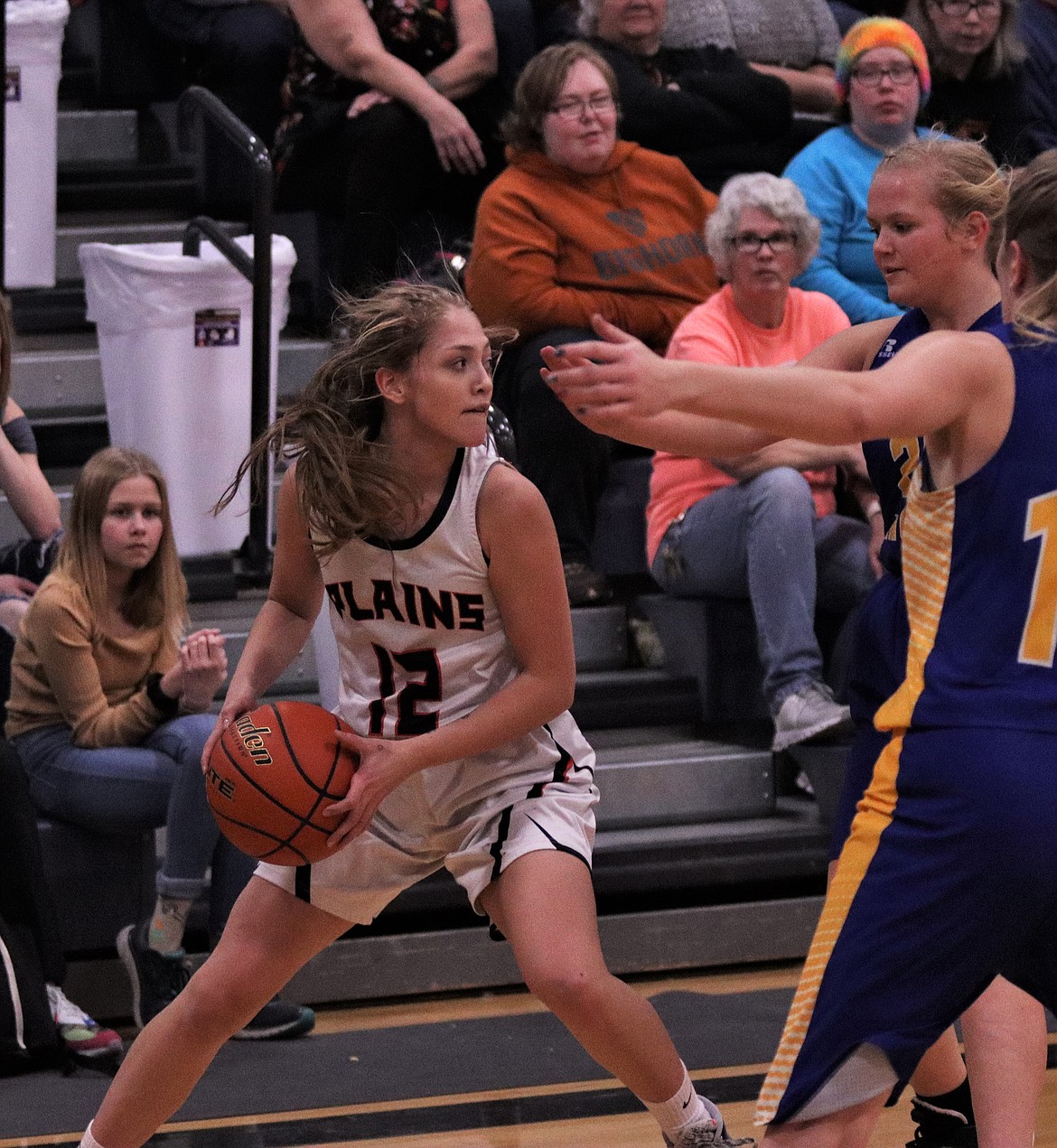 KAYLAH STANDEFORD tries to pass the ball over Thompson Falls defense Friday night. (John Dowd/Clark Fork Valley Press)