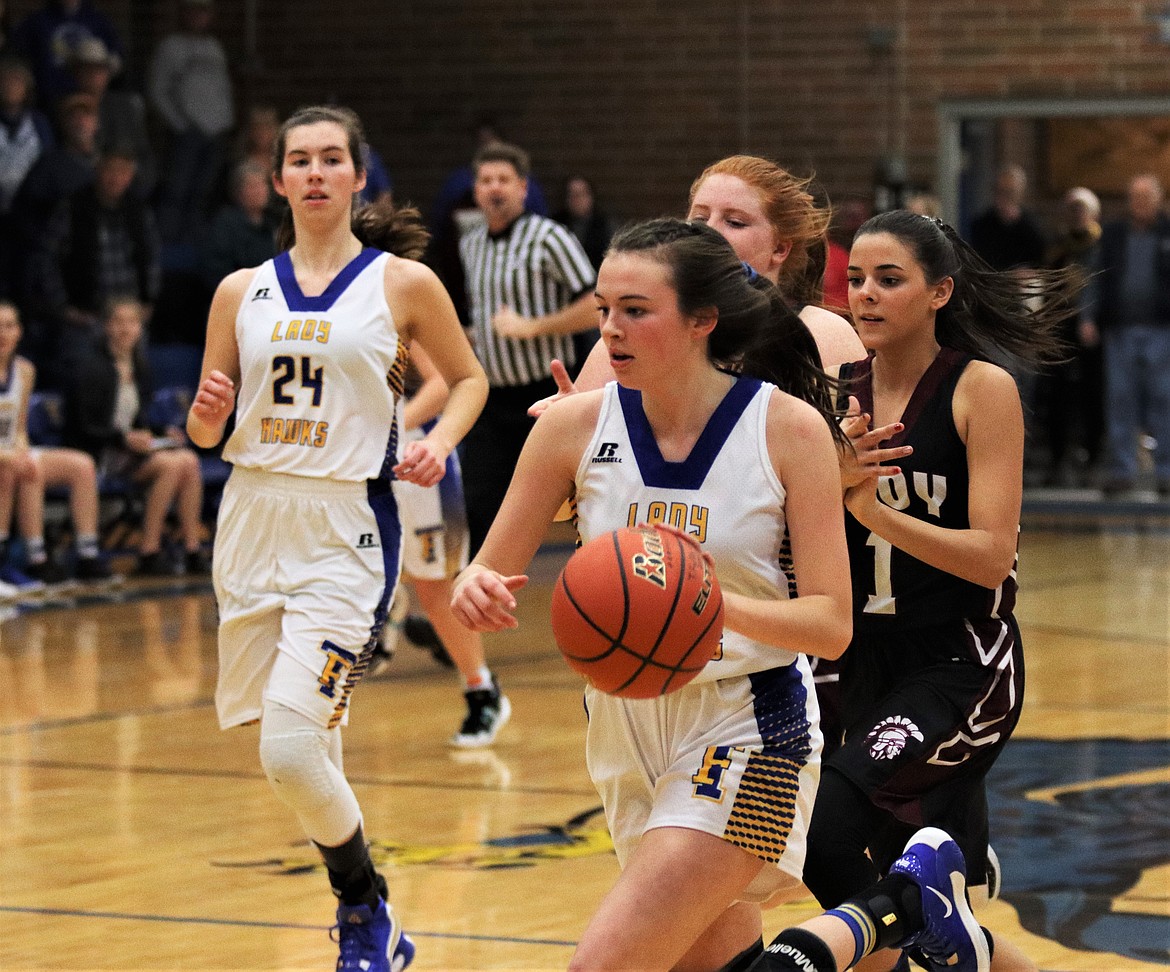 ELLIE BAXTER runs the ball upcourt for Thompson Falls against Troy last week. (John Dowd/Clark Fork Valley Press)