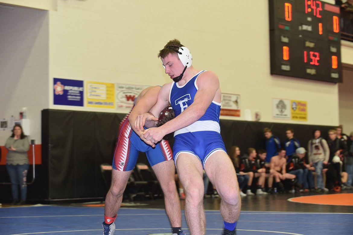 Thompson Falls 170-pounder Dane Chojnacky gets out of the grasp of Clark Fork&#146;s Carter Woodson during their match Saturday at the Western Duals in Ronan. Chojnacky scored a pin at the 3:37 mark. (Scott Shindledecker/Clark Fork Valley Press)