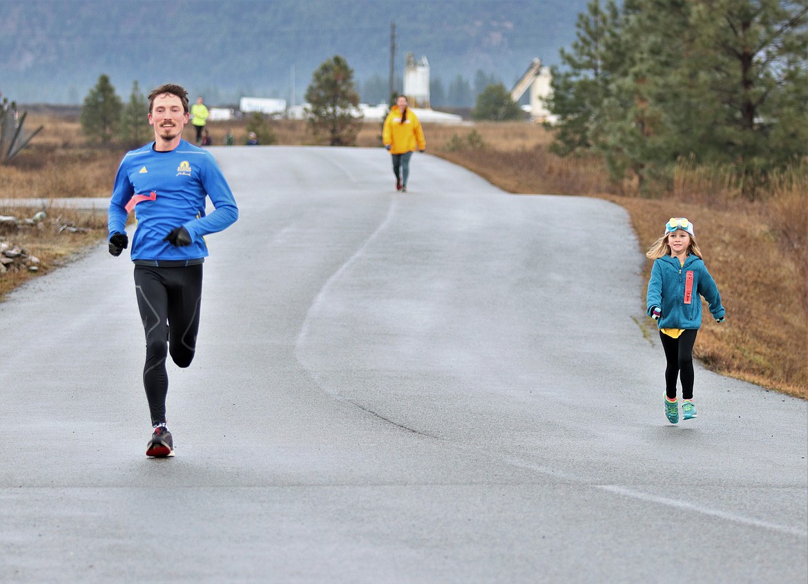 SARIA SCHERZER on the right, running next to her cousin, Jacob Naegeli on the left. (John Dowd/Clark Fork Valley Press)