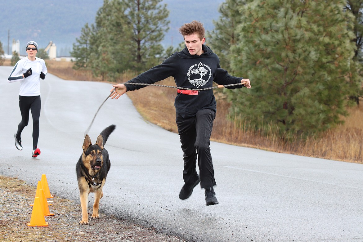 IRAM MOORE finished the 5k with his trusty sidekick, Noble, a German shepard. (John Dowd,Clark Fork Valley Press)