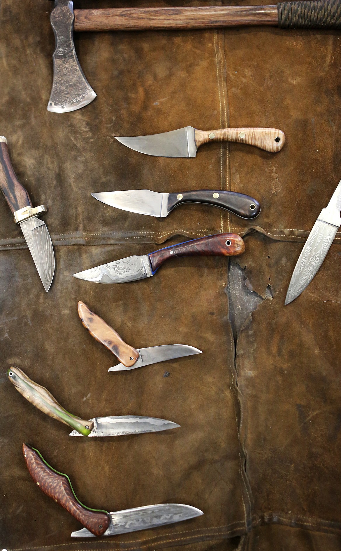 A collection of knives hand-crafted by Scott Sweder, of Columbia Falls, is pictured Jan. 2.  (Mackenzie Reiss/Daily Inter Lake)