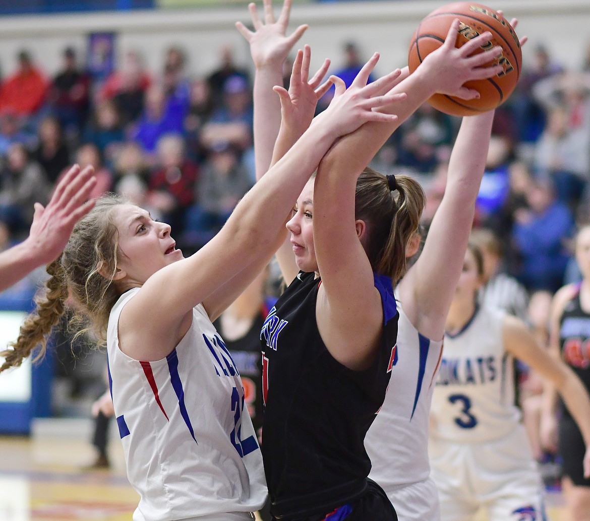 Hannah Schweikert presses a Bigfork player. (Chris Peterson photo)