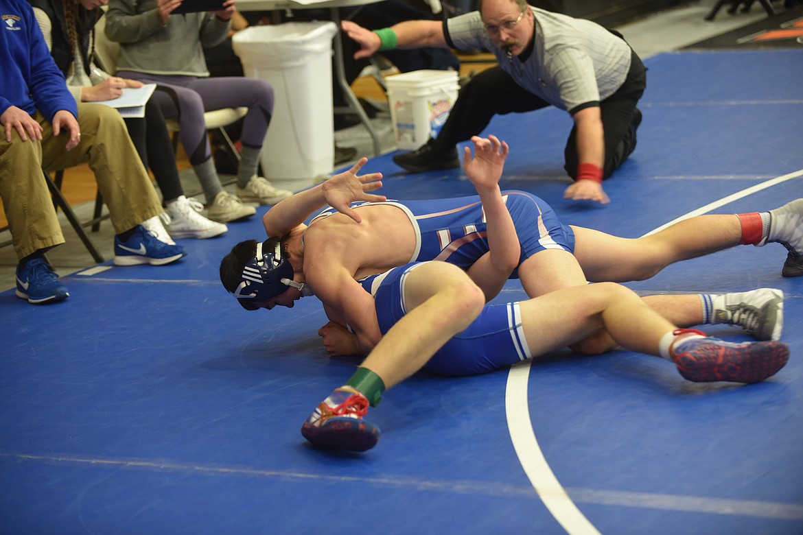 Clark Fork 145-pounder Isaiah Kovalsky has Thompson Falls Bluehawk wrestler Derek Andersen on his back at the edge of the mat during the Western Duals in Ronan Saturday. Kovalsky didn't score the pin in that sequence, but a bit later in the match at the 2:52 mark he finished it with a fall. (Scott Shindledecker/Mineral Independent)