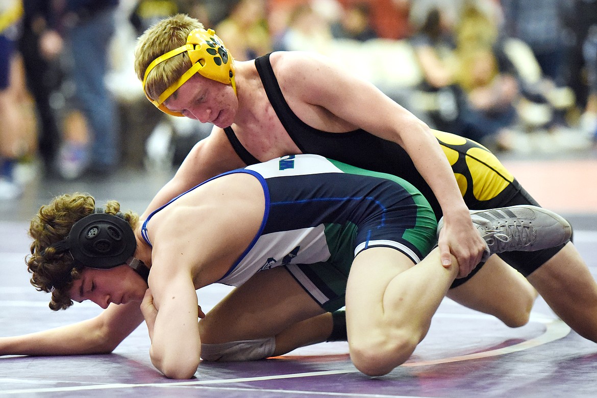 Whitefish&#146;s Carter Moran wrestles Glacier JV&#146;s Curtis Wiley at 120 lbs. at the Western Montana Duals at Ronan High School on Saturday. (Casey Kreider/Daily Inter Lake)