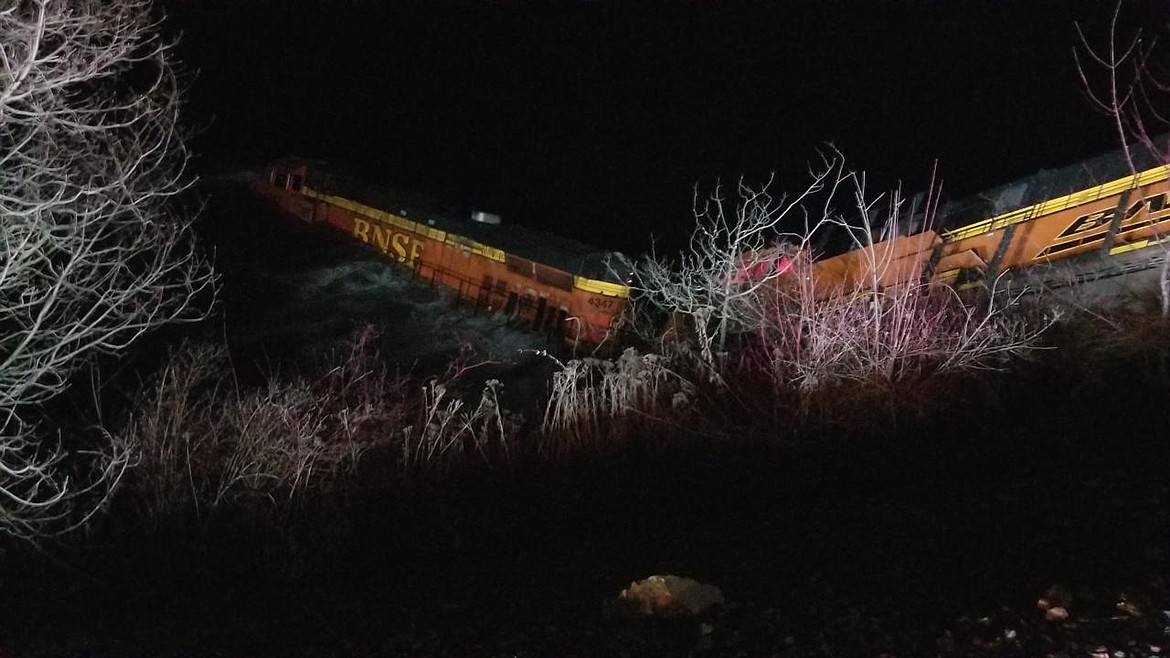(Courtesy photo)A BNSF Railway train sits in the Kootenai River after derailing late Wednesday night. The derailment sent at least one car of the 113-car train into the water with the crew temporarily trapped before escaping the engine and sitting on the top before they were rescued.