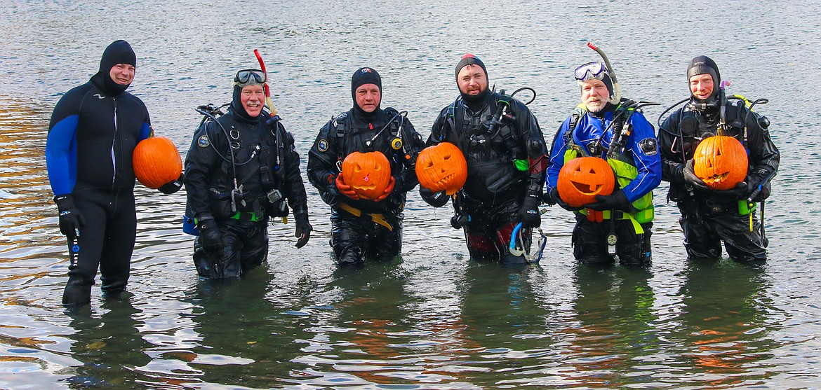 Photo by MANDI BATEMAN
Rescue diving team members, Bryant Brown, Dave Kramer, Levi Falck, Travis Stolley, Clint Randall and Caleb Watts took to the Kootenai River on Friday to carve pumpkins and train for potential river rescues on Oct. 25.