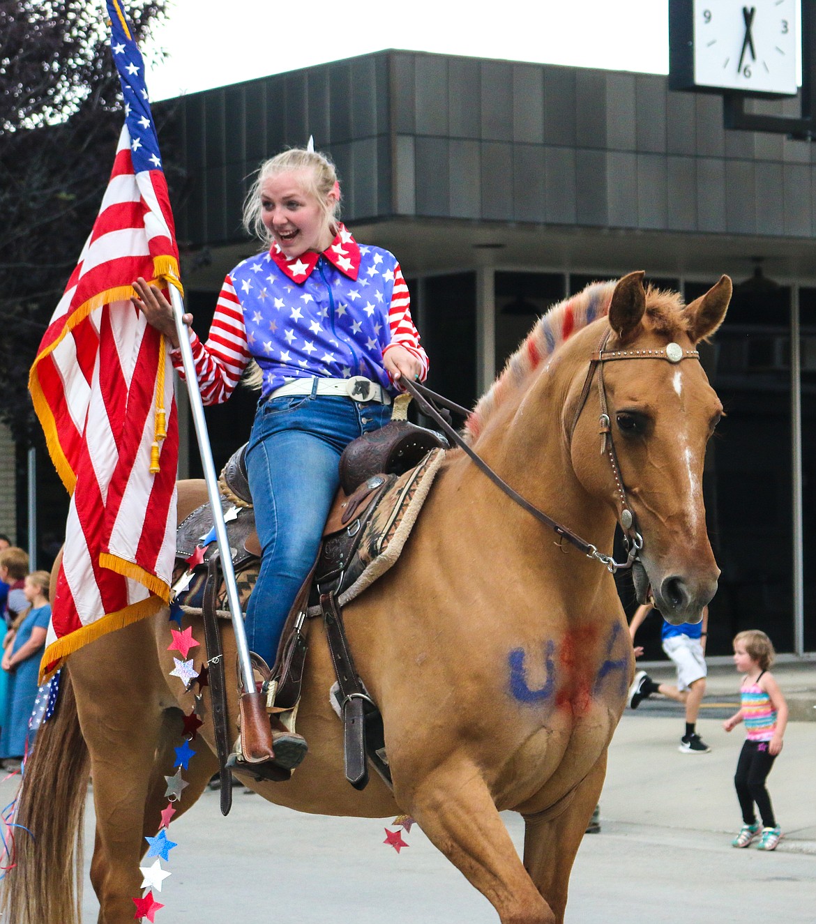 Photo by MANDI BATEMAN
Gracie Adams riding in the Fourth of July parade, showing her country pride.